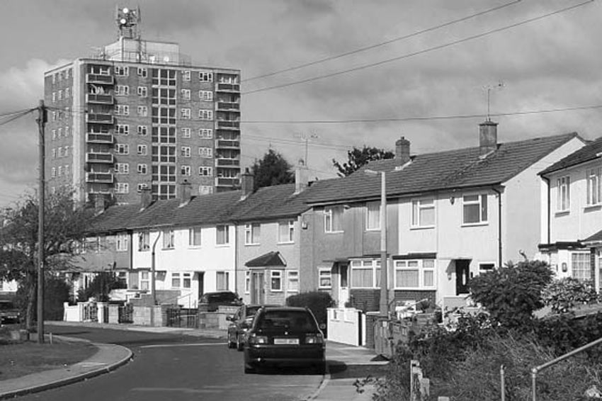 road on outer estate with tower block
