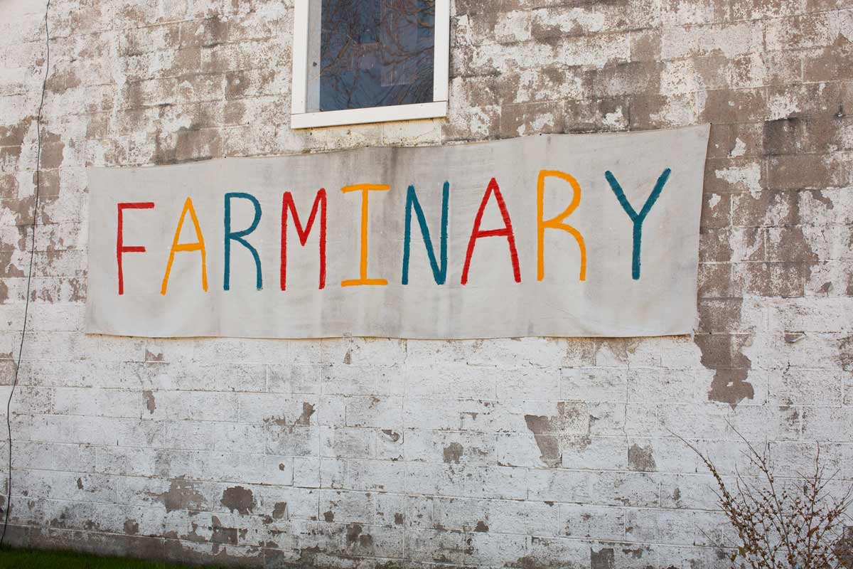Multi coloured sign: FARMINARY