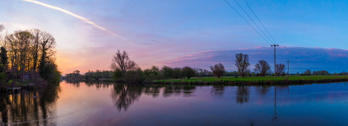 tranquil panormaic river scene at sunrise